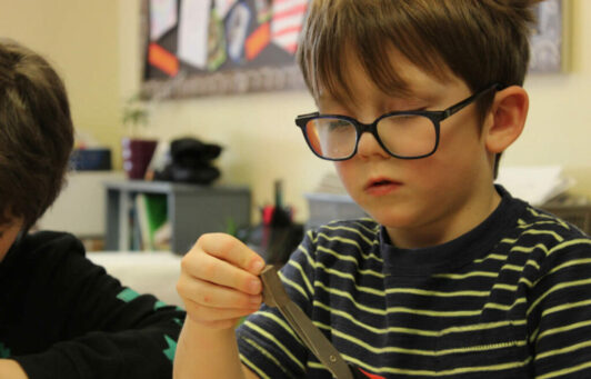 Child using a scissors