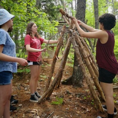 Students building a wooden structure