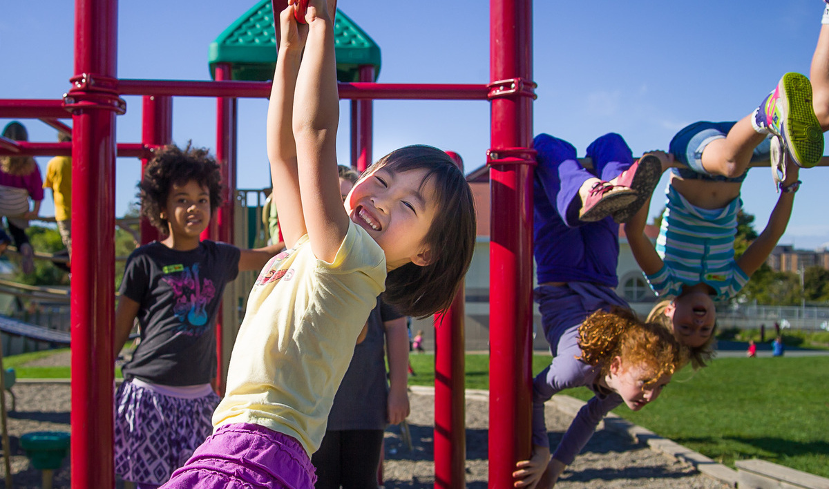 Children playing on a playground structure