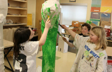 Three children painting